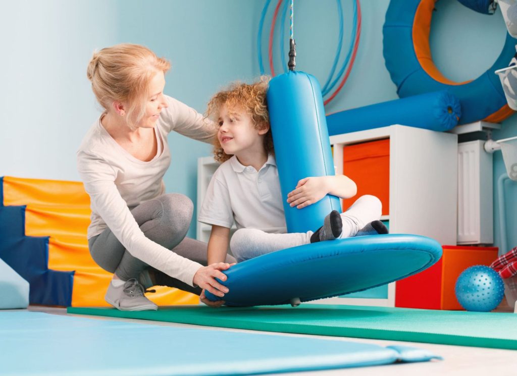 therapist doing Pediatric Therapy